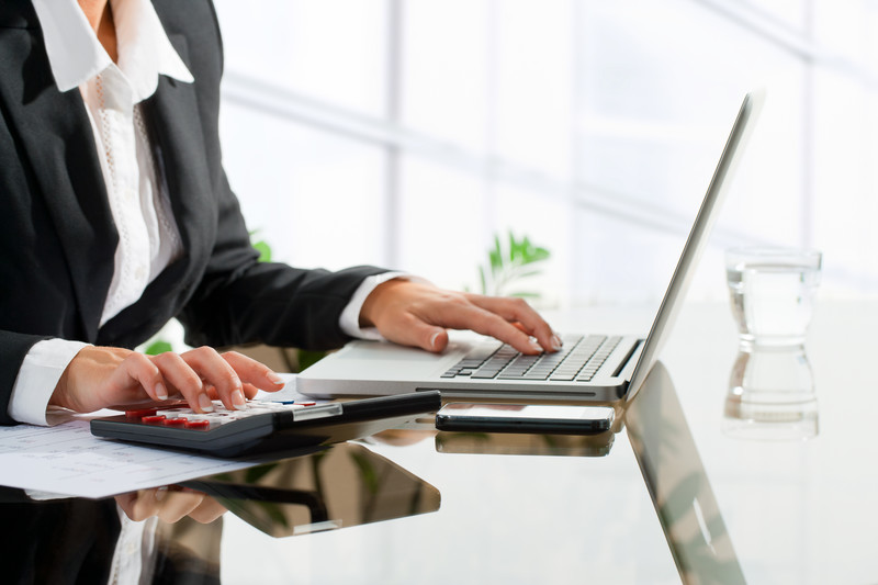 woman typing on laptop