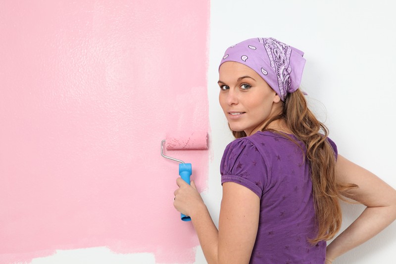 woman painting a wall