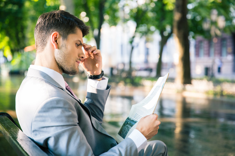 man reading paper