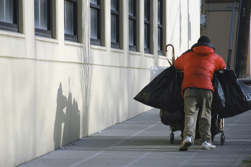 homeless man with belongings